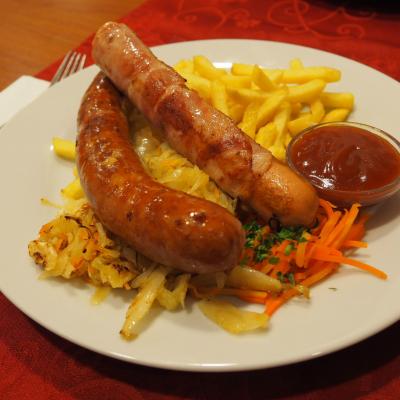 2 sausages served with french fries, cabbage and ketchup - Restaurant Lubella in Vienna, Führichgasse 1